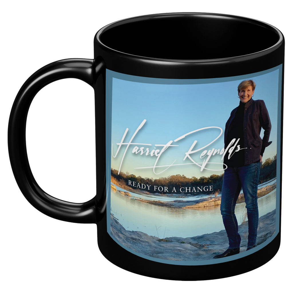 http://harrietreynoldsmusic.com/cdn/shop/products/Black_Mug_-_11_oz_Ready_for_a_Change_11oz_Black_LH_Mockup_png_1024x.jpg?v=1653665067